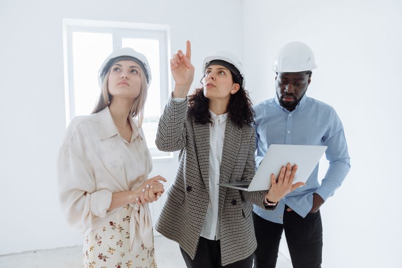 a homeowner talking to the renovation contractors